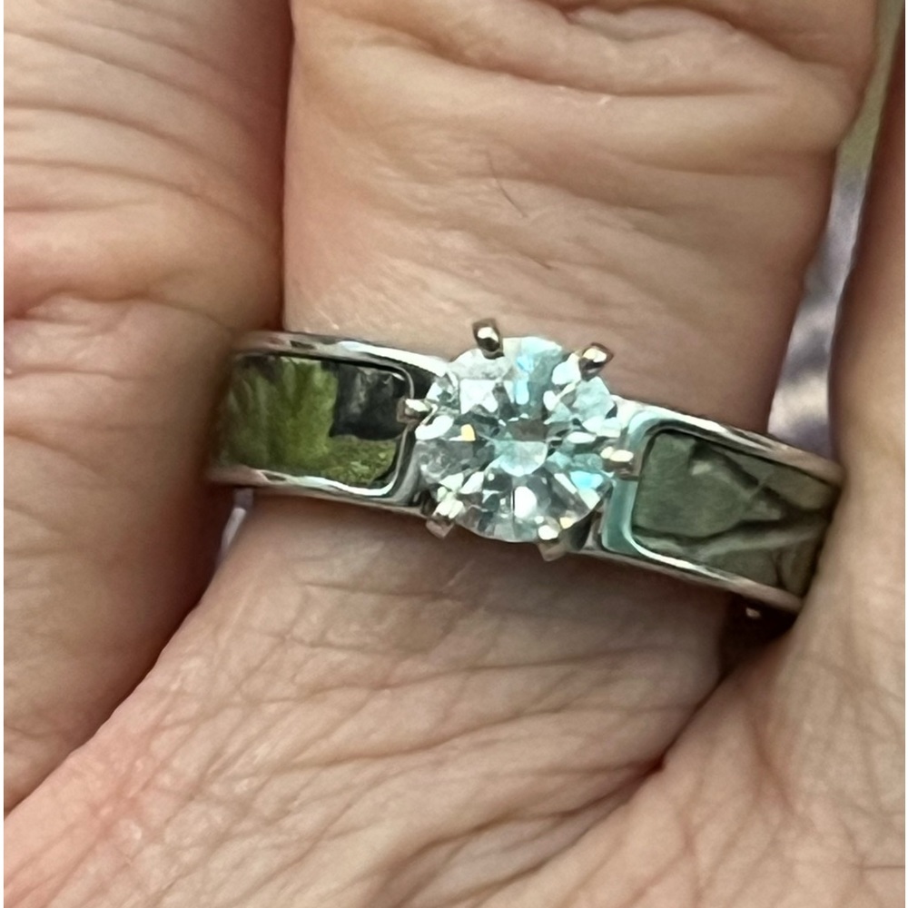 Camouflage engagement in stainless steel with a 14k gold 6 prong setting head.